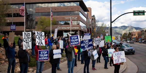 Weekly protesters gather outside U.S. Rep. Jeff Crank’s district office on Pikes Peak Avenue in Colorado Springs